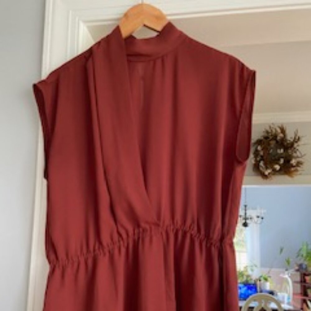 Worthington sleeveless blouse with high neck and draped front, Size M.
